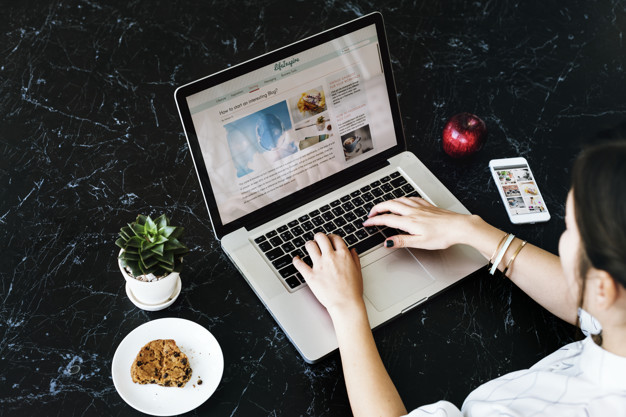 woman writing on a blog